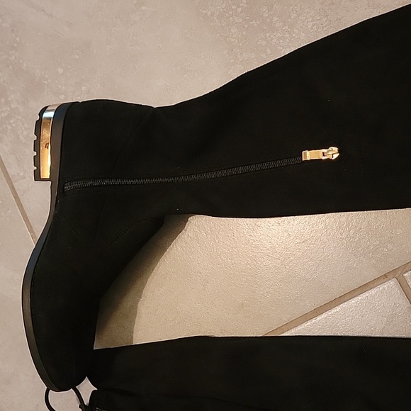 Knee-length boots with gold heel accent, side zipper, and adjustable back laces. - Picture 3 of 14